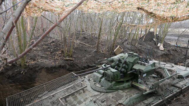 Tilt-down view of a Russian BMD-4M, an airborne assault vehicle designed for rapid attacks, is seen here in a static defensive trench&mdash;a sign of the current reality of the war in Ukraine.