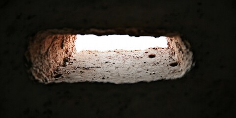 The massive, weathered blast door of a Cold War-era military bunker, scarred by time and elements.