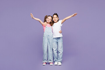 Full body smiling cheerful little two friends kids children girls 9-10 years old wear casual...