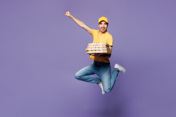 Full body young delivery guy employee man he wear yellow cap t-shirt uniform workwear work as...