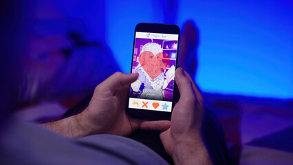 Person like an anime girl on waifu dating app smartphone over shoulder view laying on bed