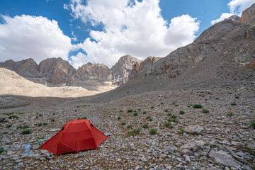 The scenic views of Demirkazık summit, Davlumbaz summit and dipsiz göl at the Aladağlar National park in Niğde, Turkey