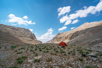 The scenic views of Demirkazık summit, Davlumbaz summit and dipsiz göl at the Aladağlar National park in Niğde, Turkey