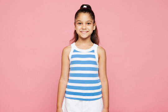Fototapeta Traveler smiling happy kid child she wearing blue casual clothes look camera isolated on plain pink background. Tourist travel abroad in free spare time rest getaway. Air flight trip journey concept.