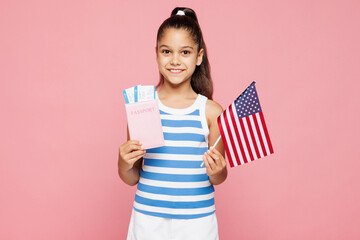 Traveler kid child wear blue casual clothes hold passport ticket American flag isolated on plain...