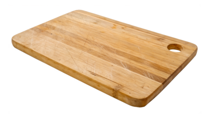 A rustic wooden cutting board with a rounded corner and a hole for hanging isolated on transparent background