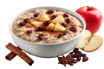 On transparent background a white bowl of oatmeal topped with apples raisins and cinnamon is served with an