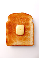 A piece of butter on toast