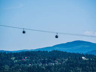 Cable Car Over Solina Lake Dam at Dusk with Full Moon in the Background, Bieszczady Mountains, Poland
