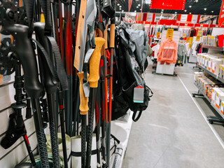Outdoor gear display featuring hiking poles and backpacks in a retail store