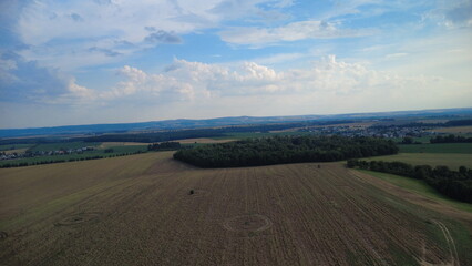 Aerial view of the landscape with fields and meadows at sunset