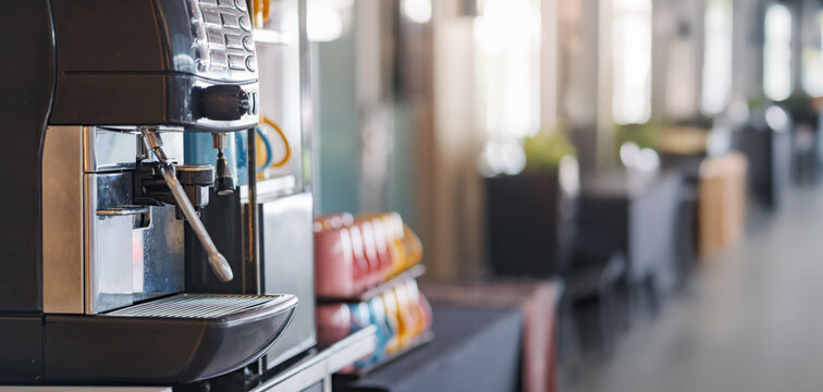 a espresso coffee making machine doing a cup of cappuccino during a day time meeting in the conference hall of hotel - Powered by Adobe
