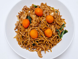 Stir-fried birthday noodles, a traditional Chinese celebration dish, features red quail eggs as...