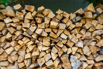 old stone wall with arches and green ivy filled firewood, close up of architectural details