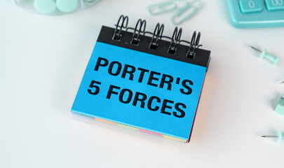 A blue notebook with the word Porter's written on it