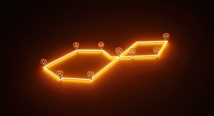 A neon light art installation displays a stylized, glowing map with various connected nodes on a dark wall.