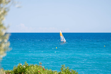 Sailboat on turquoise sea &ndash; peaceful summer escape in the Mediterranean