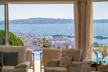 Luxury living room with panoramic sea view over Cannes bay

