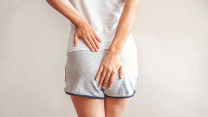Person with hemorrhoids and constipation