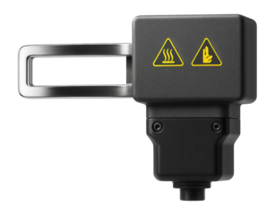 Induction heater with a flat rectangular coil for surface hardening of metal sheets in a rolling mill