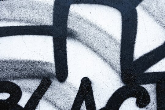 Monochrome graffiti with bold black lines on textured wall. Urban, street art, retro 90s, abstract design. Posters, flyers, modern 2000s creative banner, digital art. - Powered by Adobe