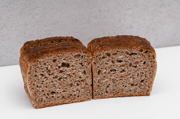 Rye bread with sunflower seeds, cut in half