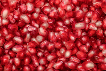 Pomegranate seeds, juicy tropical fruit, tasty and healthy anti-cancer food, antioxidants