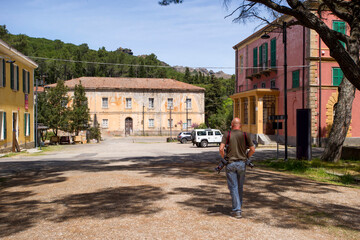 Tourist strolling the old mine town of Montevecchio, Arbus Guspini, Sardinia, Italy