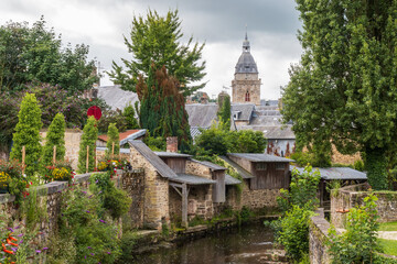 The wash houses of the quays and Bell tower of the church in Villedieu-les-Poêles in Normandy