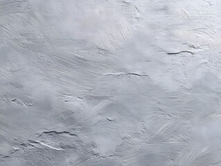 Concrete gray plaster wall with sweeping brush marks.