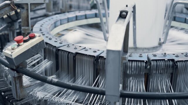 Polypropylene bags production. The work of a circular loom in the workshop at the enterprise.
