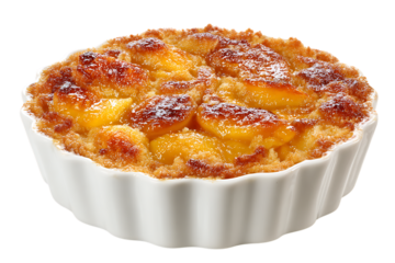 On transparent background a closeup view of a golden brown baked peach cobbler in a white ruffled ramekin
