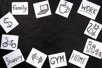 Many paper cards with hand drawing of different life activities. Life balance concept