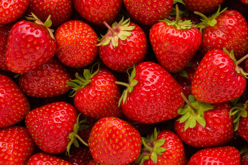Red bright strawberries background. Fresh berries. Closeup. Top down view.