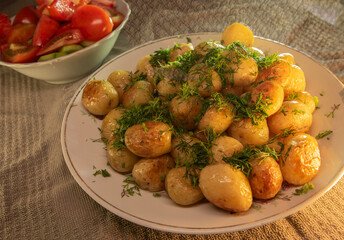 Young fried potatoes with dill