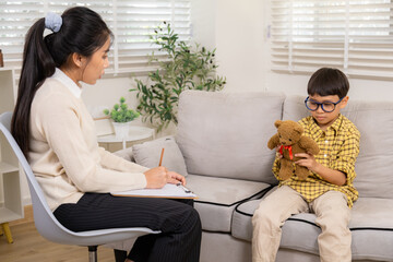 Therapy, child, counseling, psychologist, emotion conveyed through gentle interaction as female...