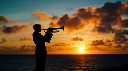 Silhouette of a musician playing trumpet at sunset over ocean creates serene vibe