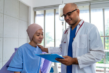 Asian woman cancer patient smiling and happy with health checkup result after listening to...