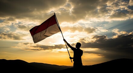 Celebrating Indonesian Independence Day with pride! Silhouette of a person holding the Indonesian flag against a vibrant sunset. Symbol of freedom and patriotism.