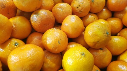 Vibrant Fresh Oranges Pile Close Up Natural Citrus Fruits Abundance. perfect for food and grocery marketing.