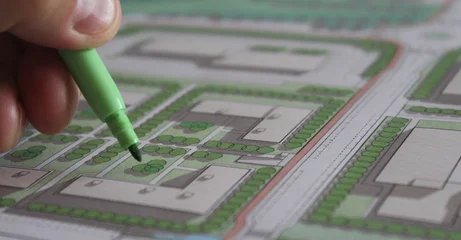 Selbstklebende Fototapeten Khaki Architetto urbanista che progetta un nuovo quartiere in città  © Alfons Photographer