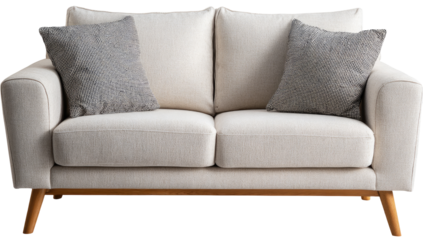A light beige or cream-colored two-seat sofa with rounded armrests and light wooden legs.  Two gray patterned throw pillows rest on the seat