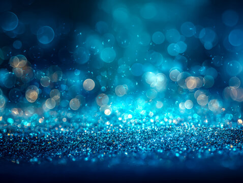Sparkling blue bokeh lights and glittering surface create a dreamy, festive atmosphere