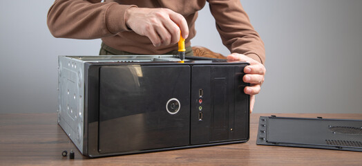 Caucasian master repairing computer. Computer maintenance