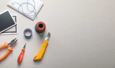 Various tools and broken tablet. Tablet repair