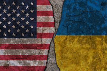 Symbolic split between USA and Ukraine flags on cracked stone wall texture