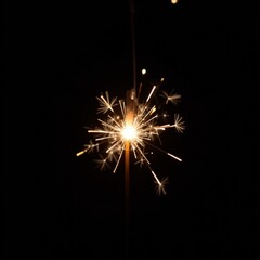Sparkler emitting fiery particles in dark space