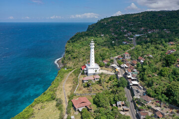 White Lighthouse by the Ocean Shore in Amed, Bali