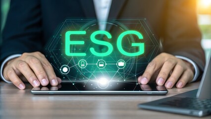Business professional interacting with glowing esg digital interface on tablet