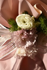 beautiful white ribbon bow on bouquet wrapper as a decoration 